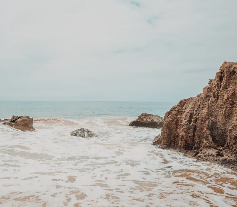 Rocky beach with water around the rocks