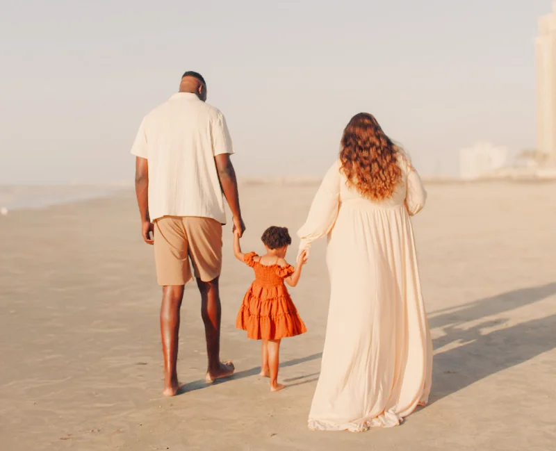 N'ganga family walking on the beach N'ganga family walking on the beach