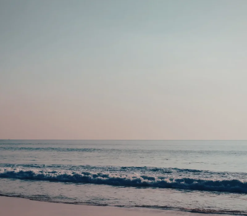 Image of a beach with gentle waves crashing Image of a beach with gentle waves crashing